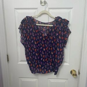 Blue sheer top with high heel pattern and bow shoulders